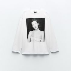 Heavy Weight - Regular Fit - Round Neck - Regular Length - Long Sleeve T-Shirt Made Of 100% Cotton. Round Neck And Long Sleeves. Front Image Of Kate Moss Iconic Images / Terry O’neill 2024. White | 0085/172 Box #100 White Oversized Top With Front Print, Oversized White Top With Front Print, White Long Sleeve Top With Front Print, Zara Long Sleeve Tops With Graphic Print, Zara Tops With Graphic Print And Relaxed Fit, White Graphic Tee By Zara, Zara Graphic Tee For Streetwear, Sporty White Graphic Print Tops, Zara White Graphic Tee Tops