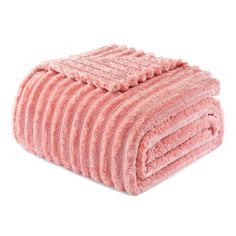 a pile of pink towels folded on top of each other in front of a white background