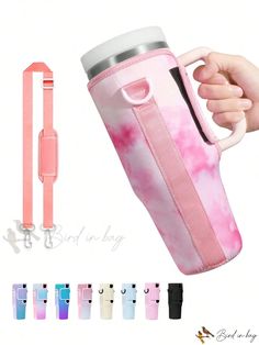 a person holding a pink and white water bottle in their right hand, with several other items around it