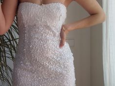 "Vintage white sequin mini dress. Strapless sequinned short dress. Size S. Fully lined with elastic fabric. Measurements lying flat: Bust: 17.3\" / 44cm Waist:13.4\" / 34cm Hips: 18\" / 46cm Length: 26\" / 66cm Very good condition." Glamorous Mini Sequin Wedding Dress, Glamorous Mini-length Sequin Wedding Dress, Glamorous Wedding Mini Sequin Dress, Glamorous Mini Sequin Dress For Wedding, Glamorous Mini-length Sequin Dress For Wedding, Fitted Mini Sequin Dress For Wedding, Fitted Mini Length Sequin Dress For Wedding, Mini Length Sequin Fabric For Prom In Spring, Elegant Mini Length Sequin Fabric For Summer