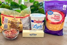 the ingredients needed to make an ice cream sandwich are displayed on a table next to bags of chips