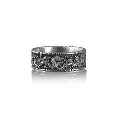 Chinese Dragon Ornament Wedding Band Ring For Men, Handmade Sterling Silver Ring, Traditional Dragon Mythology Ring, Engraved Dragon Ring This stylish ring is ideal for everyday use. The engraving details of the 925k handmade silver ring is very eye-catching. Not a shiny piece, we oxidize our designs, but can be rhodium plated on request. ★Item Details *  Gender : Male / Female *  Material : 925K Sterling Silver *  Ring Diameter: 0.80 cm (0.31 inches) *  Ring Weight: 8.00 - 8.50 Gr   ( For USA R Men’s Silver Ring Design, Adjustable Ring With Dragon Design, Symbolic Ceremonial Engraved Rings, Symbolic Engraved Rings For Ceremonial Occasion, Dragon Design Anniversary Ring Jewelry, Ceremonial Silver Engraved Ring, Anniversary Dragon Design Ring, Symbolic Engraved Ring With Intricate Design, Symbolic Wedding Rings With Decorative Band