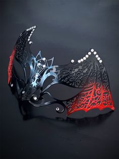 Our women's bat metal masquerade mask, adorned with red accents and sparkling rhinestones, is your key to a night of gothic enchantment and timeless beauty. Designed for hours of comfortable wear, so you can dance and mingle with ease. Whether you're attending a gothic masquerade ball or simply looking to make a dramatic entrance, this mask ensures you'll be the center of attention.


Age Group/Gender - Adult/Women

Size/Type - One size fits all adults

Mask Color - Red/Black

Mask Material - La Gothic Masquerade Mask For Halloween Theater, Gothic Eye Mask For Evening Masquerade, Gothic Masquerade Mask For Halloween Carnival, Gothic Evening Masquerade Eye Mask, Red Fantasy Halloween Masks, Gothic Masquerade Eye Mask For Theater, Gothic Masquerade Eye Mask, Gothic Style Masquerade Eye Mask, Gothic Eye Mask For Masquerade