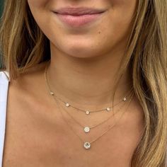 You simply can’t go wrong with a classic diamond necklace and this one takes it to the new level with a captivating round white topaz stone surrounded by dazzling dainty diamonds, this halo solitaire necklace is oh so chic. Details: • 1.47 Total Carat Weight White Topaz • .08 Total Diamond Carat Weight • 24 Pave' Set Round Diamonds • 14k Yellow Gold • Chain Length: Adjustable from 16 inches to 18 inches • Pendant: 8mm • Center Stone Size: 6mm Round Diamond Necklace, Permanent Jewelry, Solitaire Necklace, Diamond Solitaire Necklace, Gold Disc, Classic Necklace, Solitaire Necklaces, Disc Necklace, Station Necklace