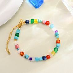 Add a pop of color to any outfit with our Colorful Seed Bead Bracelet. The vibrant pastel colors are refreshing and perfect for summer. Wear it to a party, beach, or music festival and and you'll be cheered up. This adorable bracelet is sure to make you stand out while receiving others' compliments. Find your perfect shade of color and embrace the calming energy of summer! DETAILS Plating: 18K Gold Materials: 18K Gold on Brass, Natural Stones Measurements: Length: 6.69"(17cm) + Extender: 1.57"(4 Multicolor Beaded Bracelets For Spring Vacation, Colorful Beaded Bracelets For Beach In Summer, Spring Beach Bracelets With Letter Beads, Spring Beach Bracelet With Colorful Beads, Colorful Bohemian Beaded Bracelets For Spring, Casual Multicolor Beaded Bracelets For Summer, Adjustable Pastel Beaded Bracelets For Beach, Multicolor Friendship Bracelets For Spring Vacation, Adjustable Pastel Beaded Bracelet For Beach