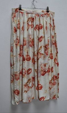 "a vintage white and red floral button-down midi-skirt ✿ IMPORTANT INFORMATION: * excellent vintage condition * material: 100% viscose * size: large - please check exact measurements below (they're there for your benefit!) ✿ MEASUREMENTS (taken while item is lying flat, some measurements will need to be doubled): * waist: 15.5\" (39cm) * hips: wide/loose * length: 31\" (79cm) ✿ free UK shipping on orders over £100 with code STRAWBERRY free international shipping on orders over £250 with code LEM Rayon Long Skirt For Daywear, Daywear Long Rayon Skirt, Spring Maxi Skirt With Buttons, Floral Print Rayon Midi Skirt, Spring Daywear Rayon Maxi Skirt, Summer Wide Leg Maxi Skirt With Button Closure, Spring Daywear Rayon Skirt, Floral Print Rayon Long Skirt, White Rayon Summer Skirt