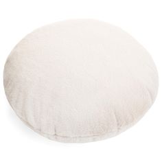 a white round pillow on a white background