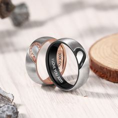 two wedding rings with the words love you to the moon and back engraved on them