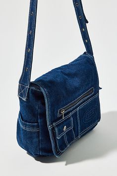 Essential messenger bag crafted from premium BDG denim. Low-profile silhouette with a pocketed flap closure. Lined interior with two pockets and plenty of space for your essentials. Complete with a zip pocket at the back for easy access, plus a water bottle pocket at the side. Finished with an adjustable strap - wear it on your shoulder or crossbody. Urban Outfitters exclusive. Features BDG denim messenger bag Washed soft denim with tons of storage Plenty of pockets inside and out Water bottle p Casual Flap Satchel With Pockets, Denim Messenger Bag, Denim Crossbody Bag, Jean Bag, Small Cross Body Bag, Denim Shoulder Bag, Profile Silhouette, Denim Crossbody, Sewing Clothes Women