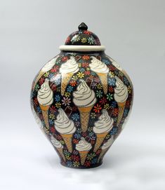 an ice cream cone decorated vase on a white background