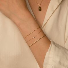 The Twisted Lace Chain Bracelet is an absolute must-have for your wrist. It’s dainty and adds just the right amount of feminine sparkle you have been looking for. If you’re looking for a bracelet you can wear every day - you've found it! It looks amazing on its own and dainty enough to pair with your other favorite bracelets. Crafted of 14k solid gold so you can wear it 24/7 - even to the gym, shower, and to sleep. This bracelet is a sparkly treasure that you'll never want to take off! DETAILS 1 Solid Gold Bracelet, Accessory Ideas, Dainty Bracelet, Gold Bracelets, A Bracelet, Dainty Bracelets, Jewelry Photography, Favorite Rings, Stylish Jewelry