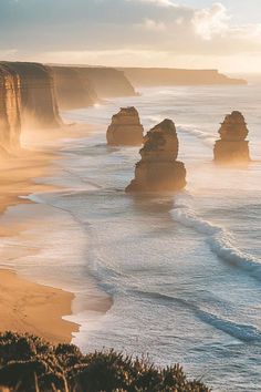 the beach is lined with rock formations and waves