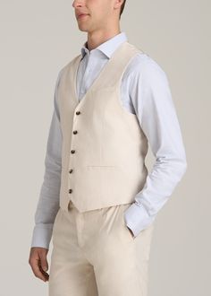 The Perfect Tall Men's Vest Elevate Your Ensemble Introducing our Stretch Linen Suit Vest, a classic wardrobe staple designed with the tall man in mind. This vest combines the timeless elegance of a tailored vest with the comfort of stretch linen, ensuring a flawless fit and enduring style. The pre-washed fabric guarantees minimal shrinkage, while the double welt pockets and button closure add a classic touch – just what you want in a tall men's jacket. Pair it with our Stretch Linen Dress Pants