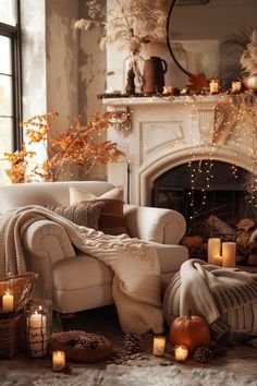 a living room filled with furniture and candles