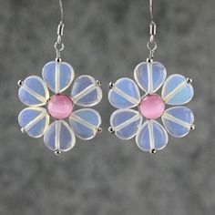 "The unique flower earrings are handmade using gemstone moonstone and pink cat eye. Free US shipping Customers who purchased this item said: \"Much prettier than the picture. The petals seem to change colors! Thank for the gift\" \"Beautiful and very well mademuch more than I expected since they are inexpensive. \" The flower is dainty and soft. It is the ultimate of femininity. The translucent quality of jade accentuate the lightness of the design. The length of the flower is 1 inch, or 2.5 cm. Pink Sterling Silver Flower-shaped Jewelry, Hypoallergenic Pink Earrings As A Gift For Her, Pink Sterling Silver Earrings As Gift For Her, Pink Sterling Silver Earrings Perfect For Her, Pink Sterling Silver Earrings For Her, Handmade Pink Jewelry For Mother's Day, Pink Moonstone Jewelry Gift, Whimsical Pink Sterling Silver Jewelry, Pink Flower Charm Jewelry For Mom