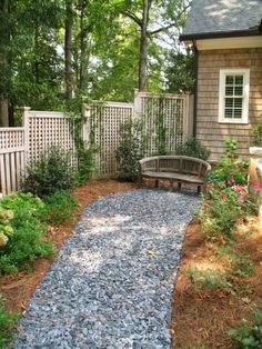 a gravel path in front of a house