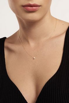 A model neck wearing GELIN 14K Gold and Diamond Floral Necklace. Delicate 14k Gold Diamond Necklace With Flower Pendant, Dainty 14k Gold Diamond Necklace With Flower Pendant, Delicate 14k Gold Flower Pendant Necklace, Delicate 14k Gold Necklace, Delicate 14k Gold Birthstone Necklace With Ethical Diamonds, Dainty 14k Gold Flower Pendant Necklace, Dainty Birthstone Necklace With Flower Pendant, Delicate 14k Gold Necklace For Anniversary, Delicate 14k Gold Diamond Necklace With Birthstone