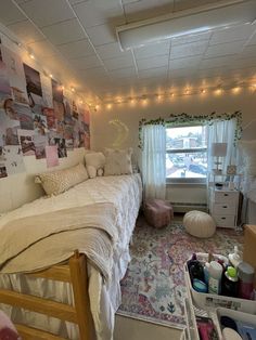 a bed room with a neatly made bed and lots of clutter on the floor