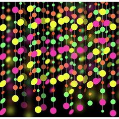 an abstract background with multicolored circles hanging from strings