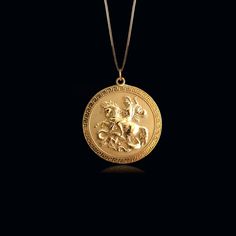 Celebrate valor with the Gold St. George Pendant. Crafted in solid gold, this pendant features St. George in his legendary battle against the dragon, symbolizing courage and triumph. The detailed design captures the heroic scene, making this pendant a powerful emblem for those who admire bravery and strength. PENDANT INFORMATIONThis pendant is made of real, solid gold.• Made in USA• Material: 14k or 18k solid gold• Finish: polished• Height: 1.1" (28,5 mm) x Width: 1" (25 mm)• Pendant weight: app George Necklace, Faith Jewelry, Solid Gold Chains, Necklace Craft, Mini Pendants, Detailed Design, Dragon Slayer, Saint George, St George