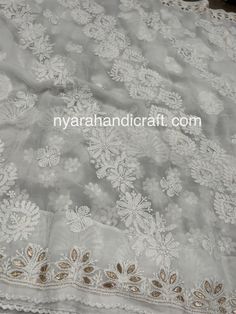 Beautiful Chikankari (famous hand embroidery style from Lucknow, City of Nawabs, India) on georgette saree with gota patti add ons. FALL ATTACHED AND PETTICOAT INCLUDED ! Includes hand embroidered blouse piece. Fitted Embroidered Georgette Fabric For Celebration, White Organza Blouse With Floral Embroidery, White Lace Embroidered Fabric For Festive Occasion, Festive White Lace Embroidered Fabric, Designer Wear Embroidered Georgette Fabric, Designer White Blouse Piece With Chikankari Embroidery, Festive White Unstitched Suit With Lace Work, Celebration Georgette Saree With Intricate Embroidery, Traditional Organza Sets With Lace Work