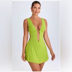 Plunge Cut-Out Mini Dress In Lime Green Regular Length Never Worn Spring V-neck Cutout Swimwear, V-neck Cutout Mini Dress For Beach, Beach Mini Dress With V-neck Cutout, Beach Mini Dress With Cutout V-neck, Summer V-neck Swimwear With Cutout, V-neck Cutout Swimwear For Summer, Green Open Front Summer Dress, Green Mini Dress For Poolside, Fitted V-neck Swimwear With Cutout