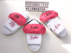 four personalized slippers with names on them and one has a name in the middle