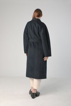 Stay Warm and Fashionable in Our Women's Woolen Coat with Belt This elegant single breast coat features weld pockets, and a tie belt. Stitching along the seams adds details to the piece. This extra long style is spun with wool and cashmere, making it warm, wind resistant, and sophisticated. Style #: WWAH914 Coat With Belt, Single Breasted Coat, Woolen Coat, Long Style, Sophisticated Style, Tie Belt, Extra Long, Stay Warm, Cashmere