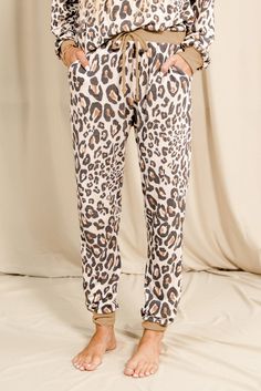 Leopard Print Long Sleeve Top and Drawstring Pants Loungewear Casual Sweatpants For Pajama Party In Spring, Casual Spring Sweatpants For Pajama Party, Stretch Cotton Leopard Print Bottoms, Stretch Leopard Print Cotton Bottoms, Trendy Drawstring Bottoms For Loungewear, Stretch Drawstring Pants For Loungewear, Casual Leopard Print Cotton Bottoms, Casual Leopard Print Sleepwear For Loungewear, Leopard Print Loungewear Bottoms