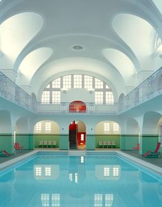 an indoor swimming pool in a large building