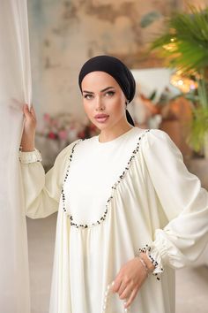 Indulge in timeless elegance with our Long Maxi Dress - Abaya. Crafted for the modern woman, this stunning white ensemble offers a seamless blend of style and sophistication. The flowing silhouette exudes modest charm, making it a perfect choice for those seeking a graceful and refined look. Whether for formal events or everyday wear, this abaya is a versatile addition to any wardrobe. Tailored to perfection, the intricate details and quality fabric ensure both comfort and durability. Elevate yo Dress Abaya, Abaya Dress, Charm Making, Long Maxi, Pakistani Fashion, Modest Outfits, Long Maxi Dress, Intricate Details, Modest Fashion