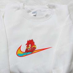 Goku Super Saiyan God x Swoosh Anime Embroidered Hoodie, Cool Anime Clothing, Best Gift Ideas for Family Tinicloset stands as an emblem of sartorial ingenuity, a haven for the fashion-forward seeking personalized expression through custom embroidered apparel. Our store’s ethos revolves around the celebration of individuality, encapsulating the fusion of artistry and style in every... White Team Spirit Sweatshirt With Embroidered Graphics, White Sweatshirt With Embroidered Graphics For Team Spirit, White Hoodie With Embroidered Graphics, White Crew Hoodie With Embroidered Graphics, White Embroidered Hoodie For Streetwear, White Embroidered Crew Hoodie, White Embroidered Crew Neck Hoodie, White Sweatshirt With Embroidered Sports Graphics, White Sweatshirt With Embroidered Graphics For Sports