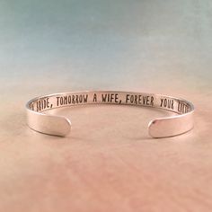 "♥︎ This bracelet is made to order. Thank you for your patience and for shopping handmade! ▶︎▶︎▶︎ ABOUT THIS BRACELET ◀︎◀︎◀︎ ✺ TODAY A BRIDE, TOMORROW A WIFE, FOREVER YOUR LITTLE GIRL. ✺ hand stamped and made of sterling silver, golden brass, or rose copper (you choose) ✺ Lightly hammered texture ✺ Bracelet is 1/4\" wide and 6\" long and is adjustable to fit most wrist sizes. ✺ For very small wrists, you can request a 5 1/2\" bracelet. Contact me for larger bracelet options. ✺ Will come gift wra Custom Adjustable Wedding Jewelry, Adjustable Hand Stamped Wedding Bracelets, Adjustable Hand Stamped Bracelets For Wedding, Wedding Stamped Bangle Bracelet, Adjustable Engraved Jewelry For Wedding Gift, Engraved Adjustable Cuff Bracelet For Wedding, Adjustable Jewelry With Engraving Option For Wedding Gift, Stamped Sterling Silver Cuff Bracelet For Wedding, Sterling Silver Stamped Cuff Bracelet For Wedding