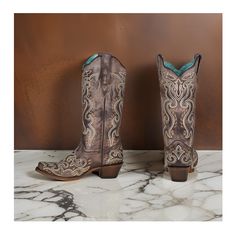 Corral Women's Brown Embroidery (Snip Toe) Western Boots Medium Sizes in a classic brown color. Crafted from top-quality full-grain leather, these boots combine elegance and Western charm for the modern woman. Equipped with pull tabs for easy on-and-off wear, these boots feature a snip toe design that adds a touch of sophistication to your ensemble. The leather lining and cushioned footbed ensure all-day comfort and support, making these boots a practical and stylish choice for any occasion. Boa Brown Embroidered Western Boots, Brown Embroidered Boots With Round Toe, Brown Embroidered Round Toe Boots, Brown Embroidered Closed Toe Boots, Traditional Brown Boots For Fall, Embroidery Boots, Brown Embroidery, Modern Cowgirl, Classic Brown