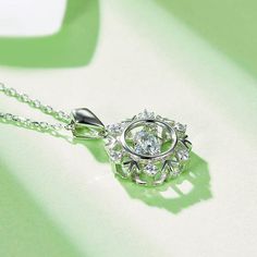 An eye-catching round moissanite dances with ease at the center of this appealing women's necklace, expressing your unstoppable love. Additional round gem set in sterling silver frame the center. Features Moissanite was originally found in meteorites(Chemical name: Silicon Carbide). It was first discovered in 1893, while a scientist was examining meteor samples from a crater in Arizona. After many years, the experts has been recreated moissanite in the laboratory, that make the gemstone with fri Moissanite Necklace With Center Stone In Round Cut, Silver Solitaire Necklace With Brilliant Cut Oval Pendant, Dazzling Round Necklace With Center Stone, Dazzling Necklace With Center Stone, Sterling Silver Solitaire Necklace With Halo Design, Silver Solitaire Flower Pendant Necklace For Anniversary, Moissanite Necklace With Center Stone As Gift, Dazzling Round Necklaces With Center Stone, Anniversary Necklace With Round Center Stone