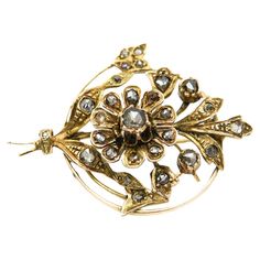 An antique brooch with 28 diamonds in old Dutch rosette cuts (round, irregular shape) set in a filigree floral form in a circle, in the realism trend of the mid-19th century. Naturalism, which was particularly fashionable at that time, was manifested in jewelry by intricate representations of floral bouquets, twigs and leaves tied with ribbons and embedded with precious stones. The gold brooch is made of 0.580 yellow gold with 0.900 silver elements, studded with 28 diamonds with a total weight of 0.80ct Color/purity G-I/SI-I1 Width: 4cm Length: 3cm The purchase is accompanied by a jewelry certificate from a diamond appraiser. Jewelry Certificate, Old Dutch, Gold Brooch, Antique Brooches, Gold Brooches, A Circle, Floral Bouquets, Antique Gold, Dream Life