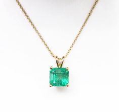 Featured here is a 2.10-carat, stunning Asscher cut Colombian emerald necklace in fine 14K yellow gold. Displayed in the center is a medium-green emerald with very good crystal clarity, accented by a simple four-prong gold mount, allowing for the emerald to be shown in full view. The earth mined, green Colombian emerald has a desirable lush green color with excellent qualities. An 18 inch, 14K yellow gold chain will be provided with this beautiful pendant! This necklace is ideal for everyday use Classic Emerald Birthstone Necklace For Formal Occasions, Classic Emerald Necklace As Birthstone For Formal Occasions, Classic Emerald Necklace With Prong Setting For Formal Occasions, Classic Prong Setting Emerald Necklace For Formal Occasions, Classic Emerald Cut Emerald Necklace With Prong Setting, Classic Emerald Cut Necklace With Prong Setting, Classic Emerald Necklace As Birthstone In Yellow Gold, Classic Yellow Gold Emerald Birthstone Necklace, Classic Yellow Gold Emerald Necklace Birthstone