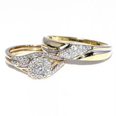 two gold wedding rings with diamonds on them