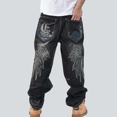 Take your look to the next level with our 2023 Autumn Collection of urban style. embroidered. mid-waist. loose denim pants with zipper & button closure. Crafted for comfort and crafted with style. these pants are the perfect blend of boldness and elegance that will make you stand out from the crowd!Distinctive Features: Street-Trend Design: Showcase your mode-setting trend with these edgy-style denim pants. Embroidered Detail: The intricate designs will add a unique touch to your look. Mid-Waist Embroidered Black Bottoms For Streetwear, Baggy Embroidered Denim Jeans, Black Embroidered Bottoms For Streetwear, Embroidered Straight Leg Jeans For Streetwear, Embroidered Cotton Jeans For Streetwear, Embroidered Wide Leg Streetwear Pants, Casual Embroidered Baggy Jeans, Casual Baggy Embroidered Jeans, Embroidered Wide Leg Pants For Streetwear