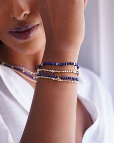 This ravishing 14K Gold Blue Lapis Bracelet has textured deep indigo stones. A gem of insight, understanding, and enlightenment, Lapis is perfect for anyone looking to strengthen their connection with their inner self. Eye-catching on its own or adds a vibrant pop when stacked with other bracelets! Made in L.A. Beads: Approx. 3mm Stretch Fit Total Weight: Approx. 2.3g Ships in 6-9 business days Rush order ships in 3-5 business days Comes gift ready in a custom Zoe Lev jewelry box Blue Spiritual Stackable Beaded Bracelets, Healing Blue Stackable Bracelets, Blue Spiritual Stackable Jewelry, Hand-strung Sapphire Beaded Bracelets, Spiritual Sapphire Beaded Bracelets Hand-strung, Spiritual Sapphire Beaded Hand-strung Bracelet, Spiritual Sapphire Hand-strung Beaded Bracelets, Spiritual Sapphire Beaded Bracelets With Natural Stones, Blue Gemstone Bracelets For Everyday Wear