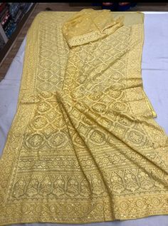 Update! - Zynah covered by LBB - https://lbb.in/bangalore/zynah-designs-handloom-sarees/ Pure Georgette Saree with intricate thread chikankari work. Beautiful motifs like flowers and diamonds are made using different kind of stitches. Sequence handwork is done through out the saree as a highlighter to enhance the beauty of saree. Dyeable to any shade as per your choice and contrast color blouse piece can be provided on demand Length: 5.5 meters Width: 1.2 meters Blouse: Running/attached with sar Gold Georgette Unstitched Suit For Festivals, Gold Lehenga With Chikankari Embroidery In Dola Silk, Gold Embroidered Georgette Fabric With Pallu, Unstitched Gold Lehenga With Chikankari Embroidery, Yellow Lehenga With Chikankari Embroidery In Chinon, Yellow Chinon Lehenga With Chikankari Embroidery, Gold Dupatta With Self Design In Chinon, Gold Lehenga With Chikankari Embroidery, Unstitched, Semi-stitched Gold Lehenga With Chikankari Embroidery