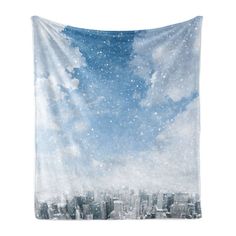 the sky is filled with stars and clouds over a cityscape in this tapestry