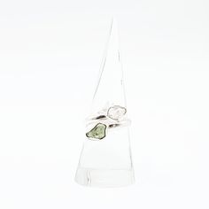 Divine Elegance Elevate your style with our exquisite Herkimer Diamond & Moldavite Ring, set in gleaming sterling silver. This stunning piece combines the celestial brilliance of Herkimer diamonds with the otherworldly energy of Moldavite, creating a ring that radiates elegance and power. Perfect for those who appreciate unique and spiritually significant jewelry, this ring is a true statement piece. Amplify Your Spiritual Journey Herkimer diamonds are renowned for their exceptional clarity and