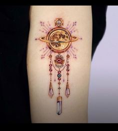 a woman's thigh with a clock and stars tattoo on her leg, which is decorated with jewels