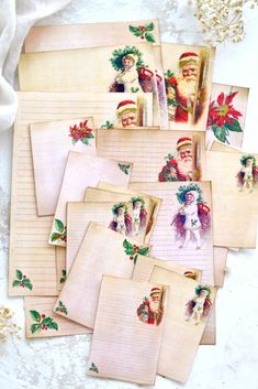 several old fashioned christmas postcards with santa claus on them and holly berries around the edges