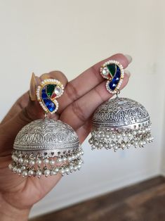 Around 3 inches Brass made Top is polished or coated with pure silver Note if u are in Instagram please visit website for more pics Handmade Silver Fusion Style Jhumkas, Handmade Silver Fusion Jhumkas, Silver Fusion Style Drop Jhumkas, Silver Meenakari Chandelier Earrings For Festivals, Silver Chandbali Chandelier Earrings With Cutdana, Silver Chandbali Cutdana Chandelier Earrings, Fusion Style Sterling Silver Jhumkas For Festivals, Silver Drop Earrings Jhumkas For Celebration, Silver Meenakari Chandelier Earrings As Gift