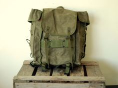 "Italian Army Backpack - Rucksack - Vintage Manbag - Italian Alpini Mountain troops from the late 70s < < < P R O D U C T D E S C R I P T I O N > > > Used by the elite Italian \"Alpini\" Mountain troops, which were established as the world's first dedicated mountain units in the 18th Century to protect Italy's northern Alpine border, this is a fantastic tough but compact canvas rucksack full of functionality. Great bag for hiking, fishing, bushcraft and collectors! The innovative design from the Vintage Green Backpack For Everyday Use, Vintage Khaki Bag For Adventure, Vintage Rectangular Backpack With Pockets, Vintage School Backpack With Pockets, Military Style Backpack For Adventure, Vintage Rectangular Backpack For Adventure, Military Style Green Backpack, Khaki Backpack For Camping, Green Military Style Backpack