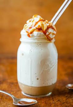 a glass filled with whipped cream and caramel