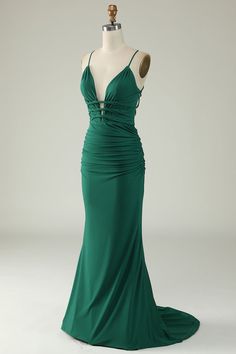 a green evening gown on a mannequin