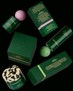 the packaging design is green and has black spots on it, along with other items